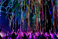 A lively multiplayer game scene with avatars celebrating a victory in a virtual arena.