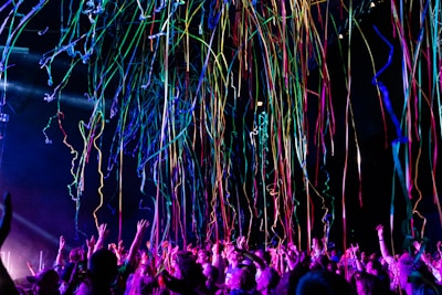 Colorful virtual gifts floating around a happy creator receiving support.