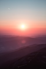 Sunrise over a mountain range symbolizing personal growth and mindset clarity