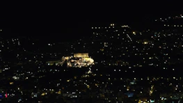 Nighttime cityscape of Edinburgh illuminated, highlighting its dynamic business district and innovation hubs.