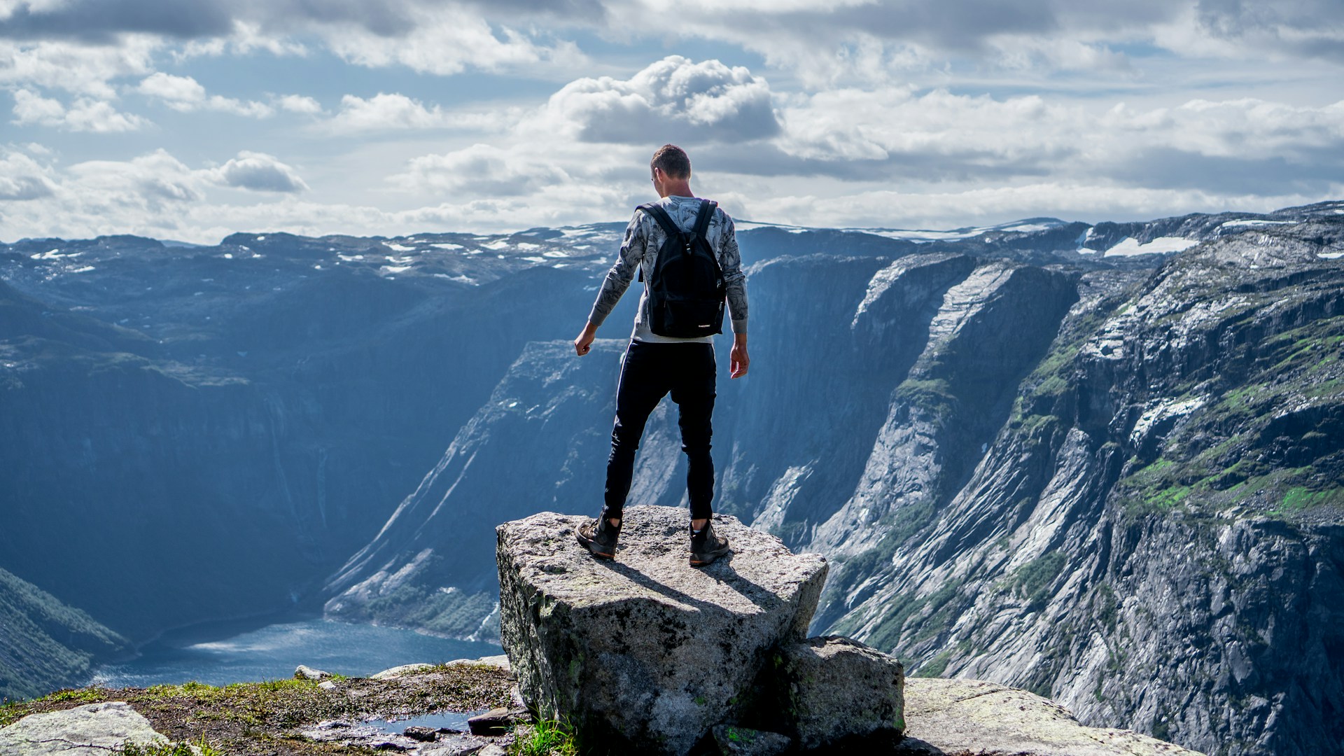 man standing on edge of cliff