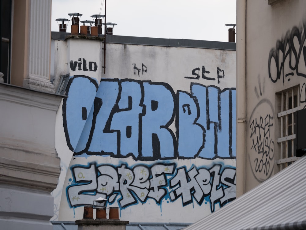 Ozar Blue graffiti on building wall