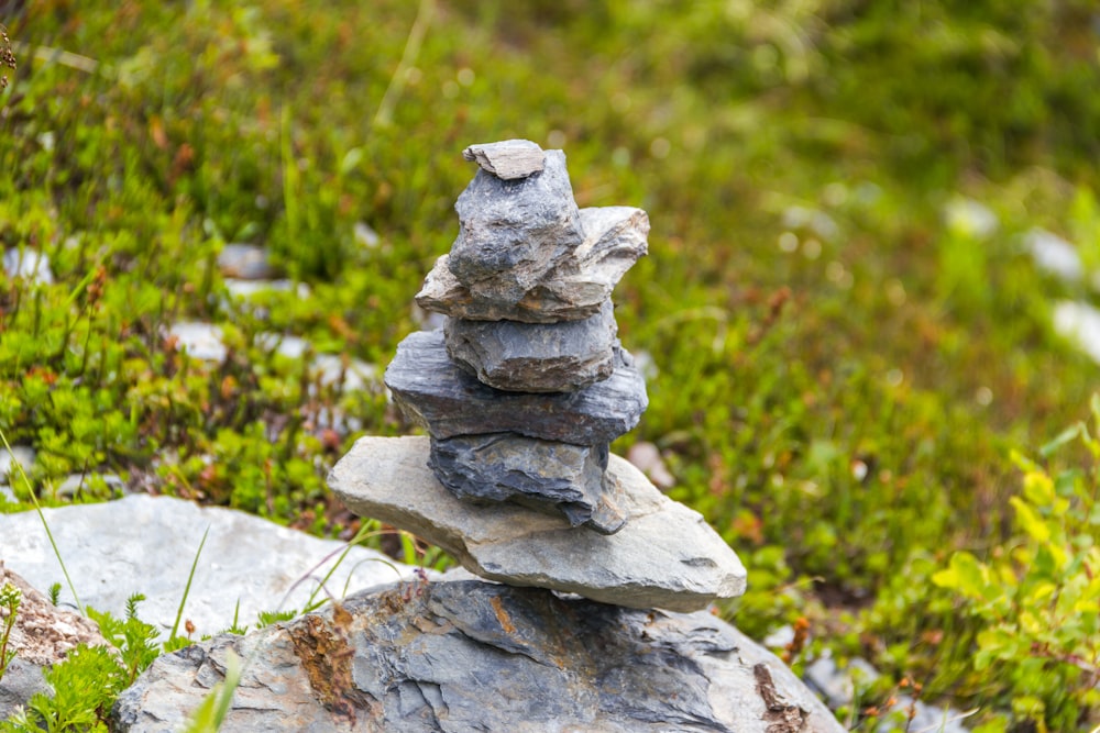 stacked stones beside grass