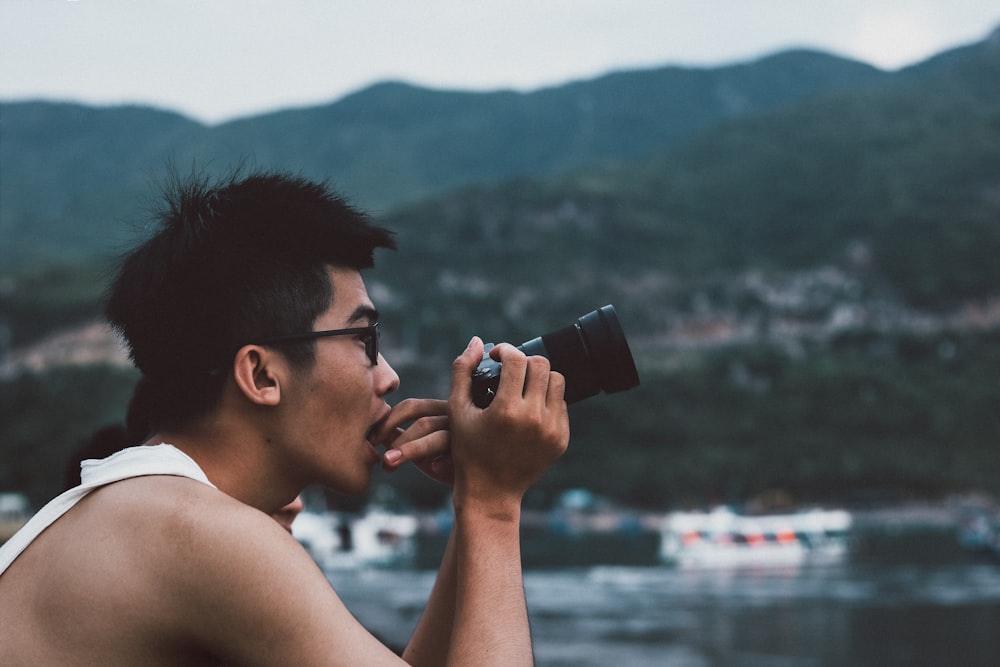 person holding camera while taking photo