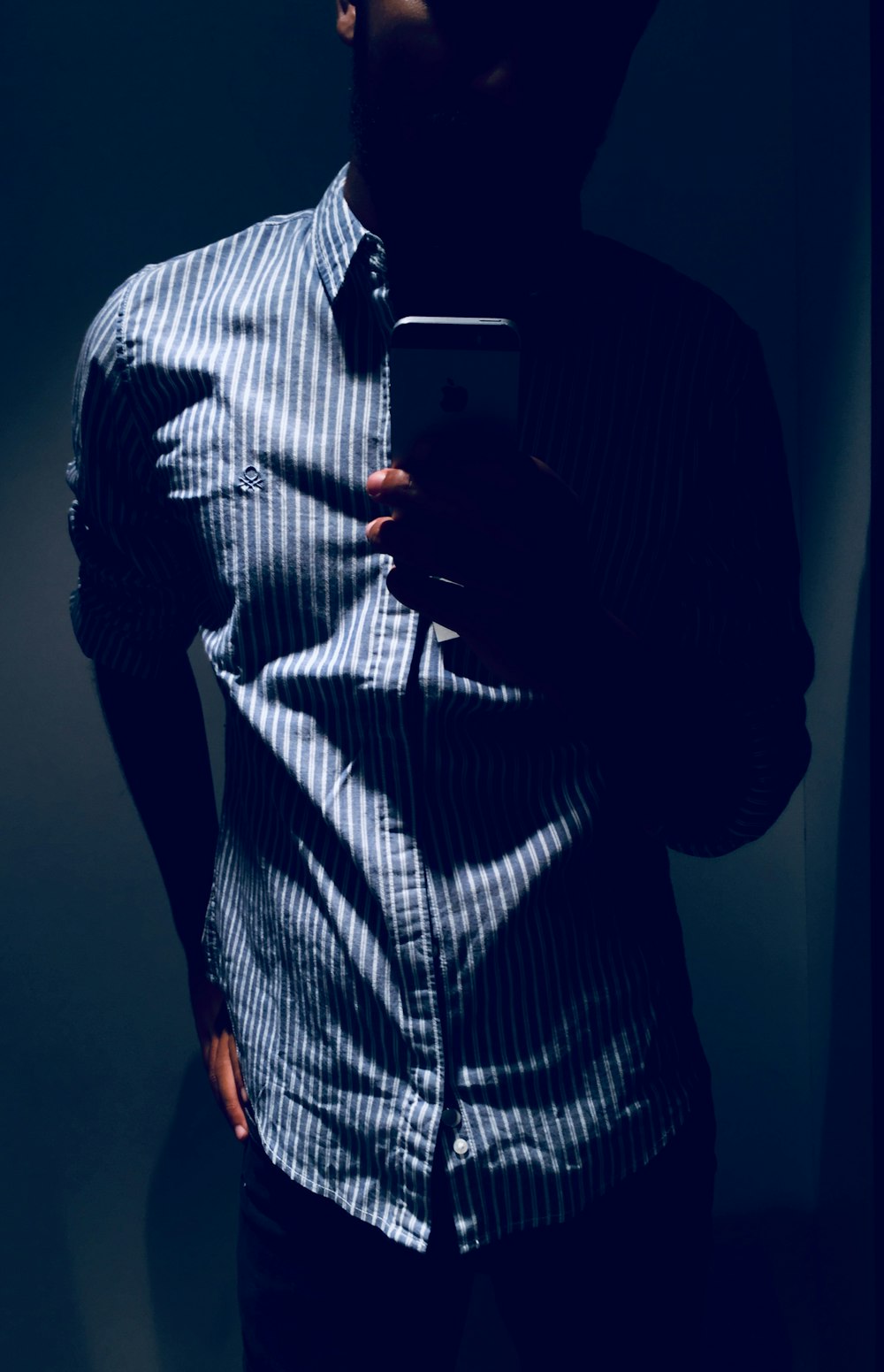 man wearing white and gray striped dress shirt