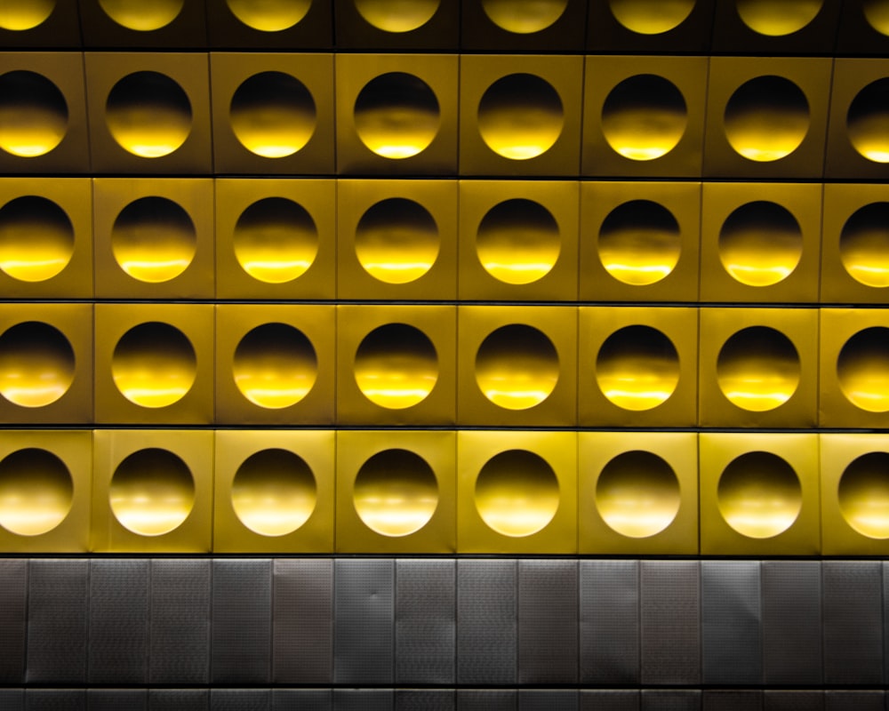 minimalist photography of gold and gray polka-dot wall