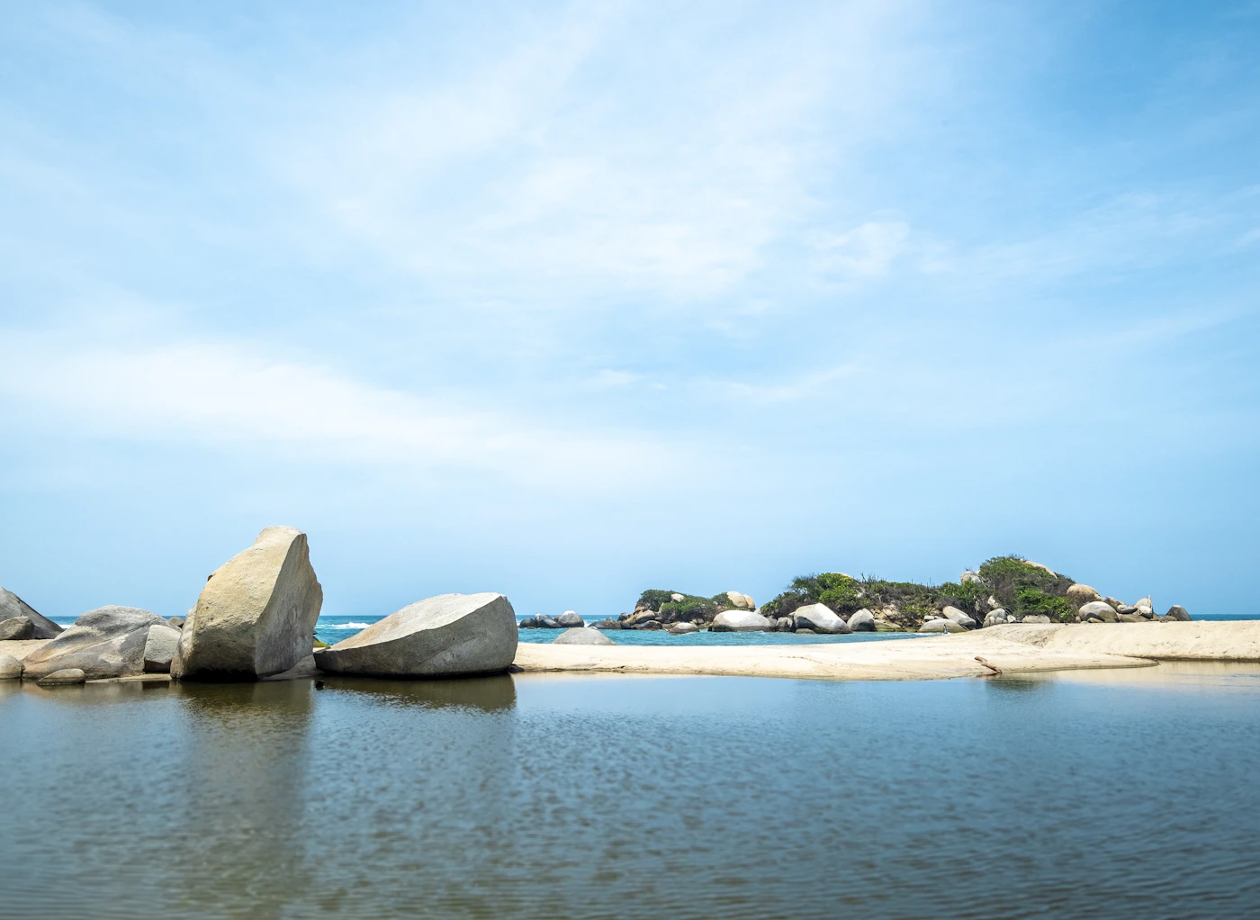 The iconic giant rounded boulders of Tayrona in calm Caribbean water