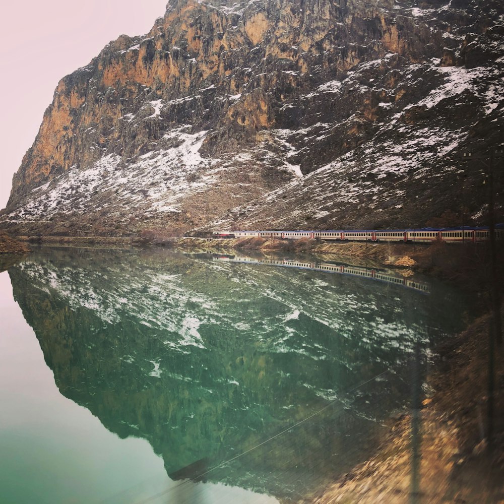 person taking a photo of body of water