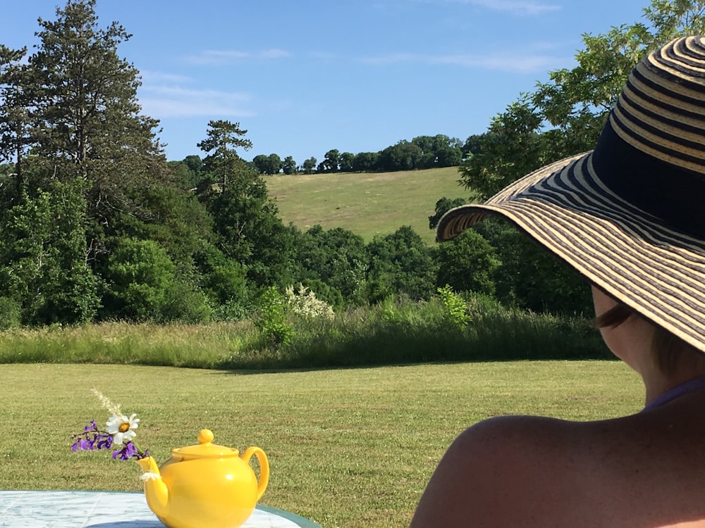 yellow ceramic teapot on table outdoor