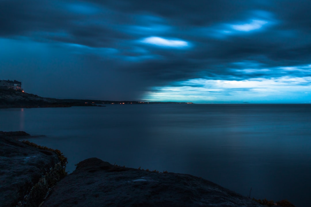 calm waters under cloudy skies