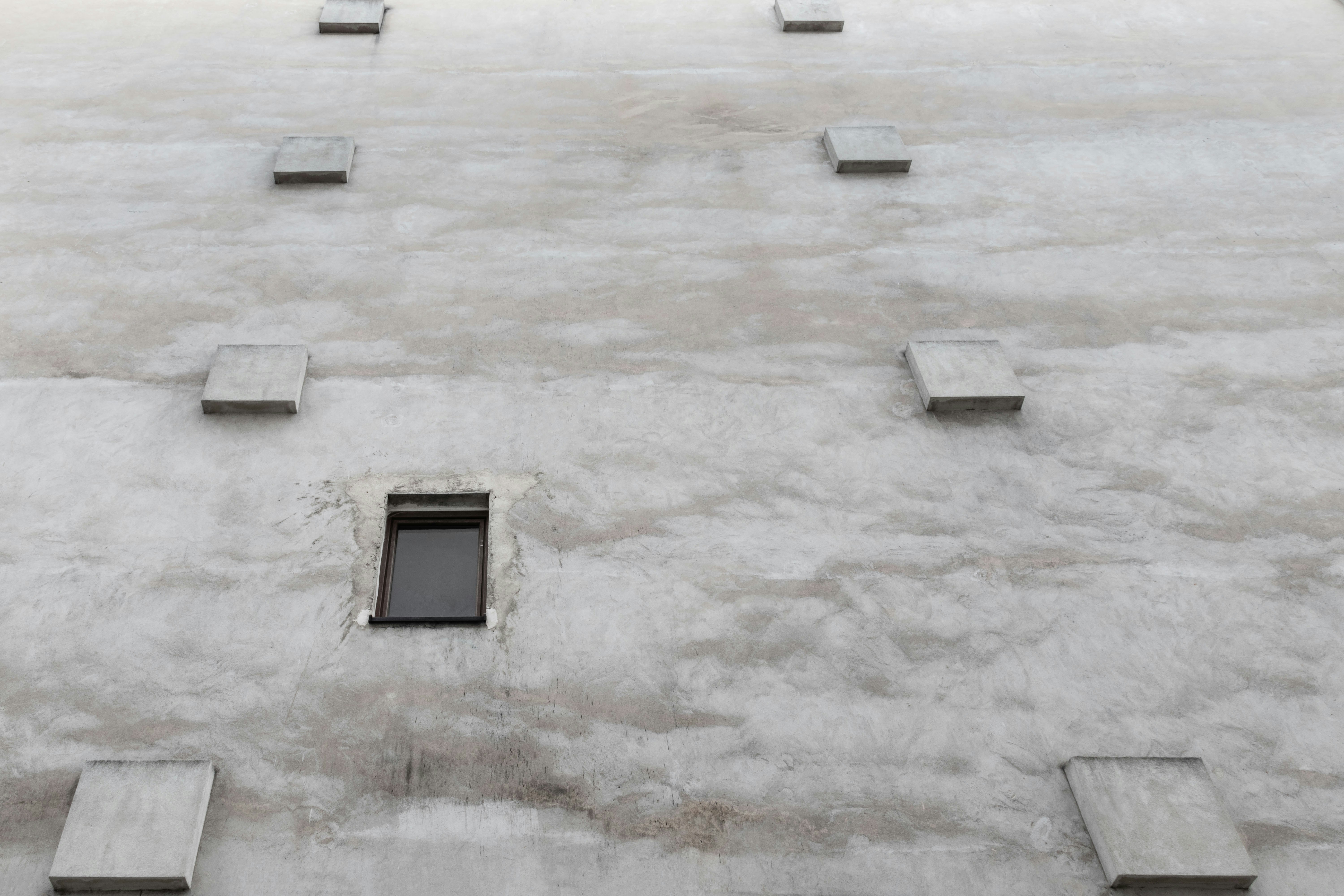 I wanted to make the illusion that you’re walking on some pavement with square structures. And the windows looks weird ;)