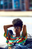 woman holding back of her head