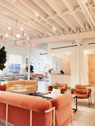 A warm, inviting reception area with soft blue and purple tones reflecting calm and care.