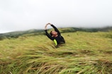 An individual stretching in a serene environment.