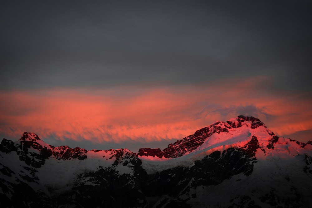 snow covered mountain at golden hour