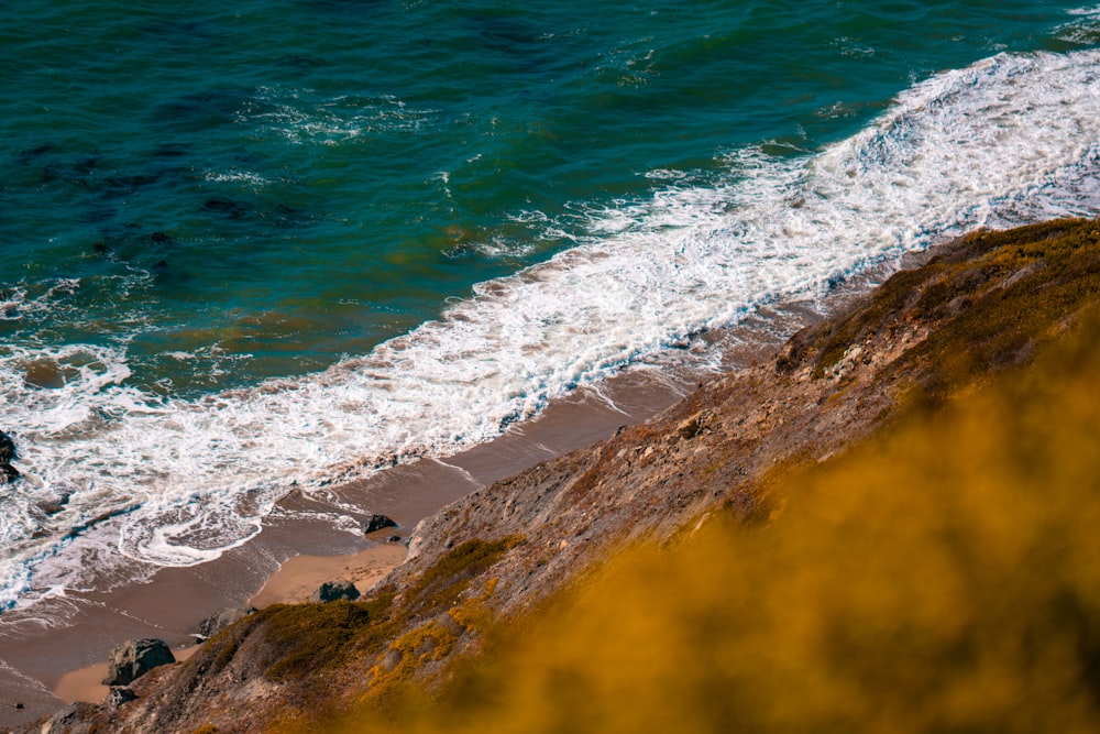 a person riding a surfboard on top of a wave