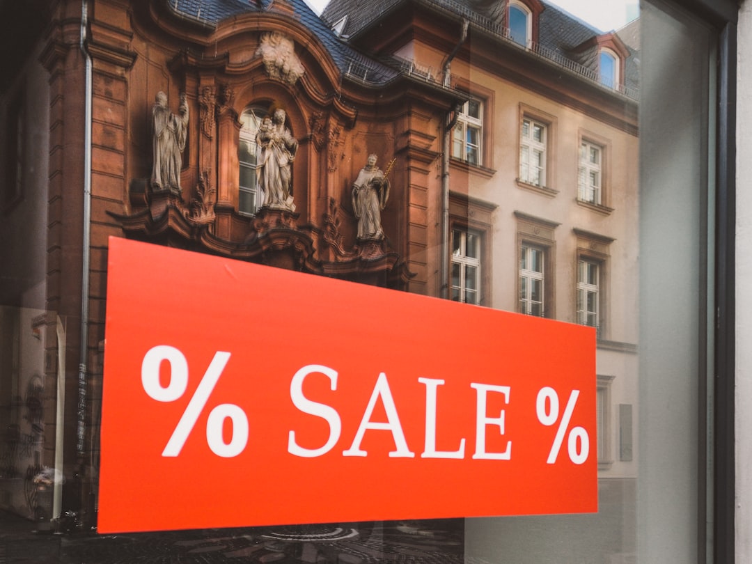 % sale % sign outside clear glass establishment