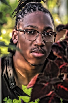 A vibrant outdoor portrait session in a lush green garden with natural light.