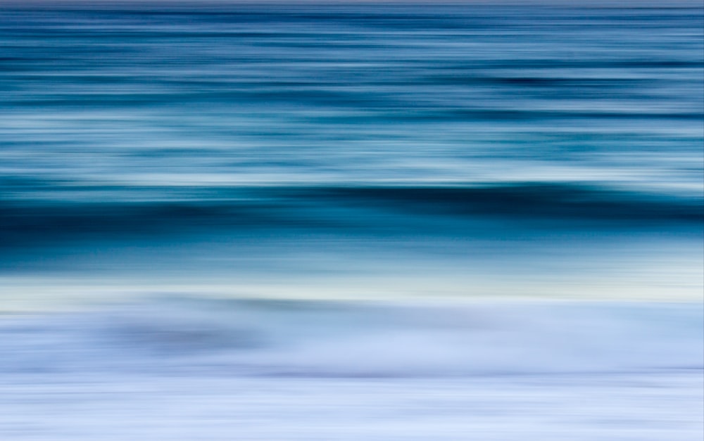 a blurry photo of the ocean waves