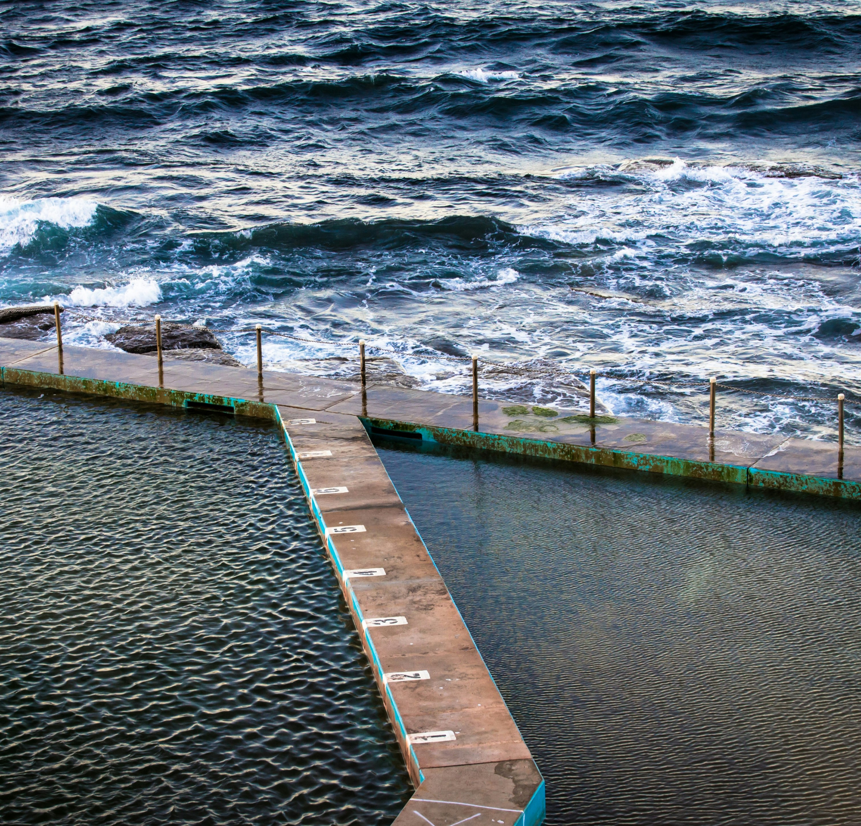 brown dock near body of water at daytime