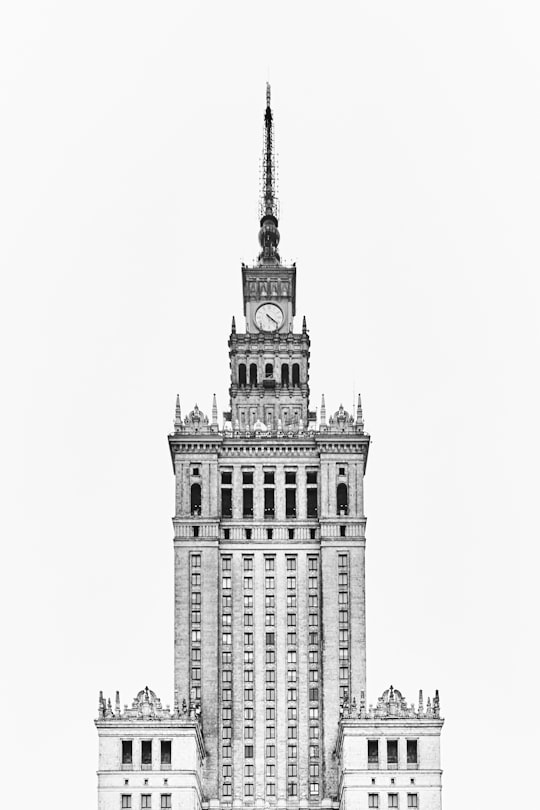 grayscale photo of Gothic concrete tower clock in Palace of Culture and Science Poland