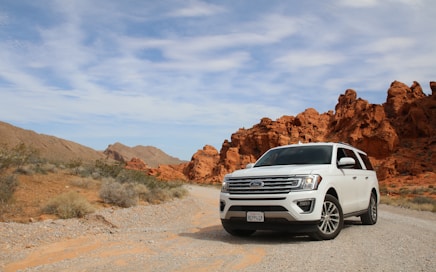 parked white Ford Explorer SUV