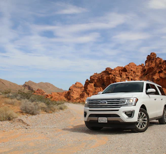 parked white Ford Explorer SUV