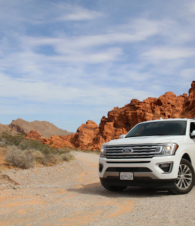 parked white Ford Explorer SUV