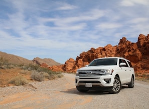 parked white Ford Explorer SUV