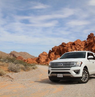 parked white Ford Explorer SUV