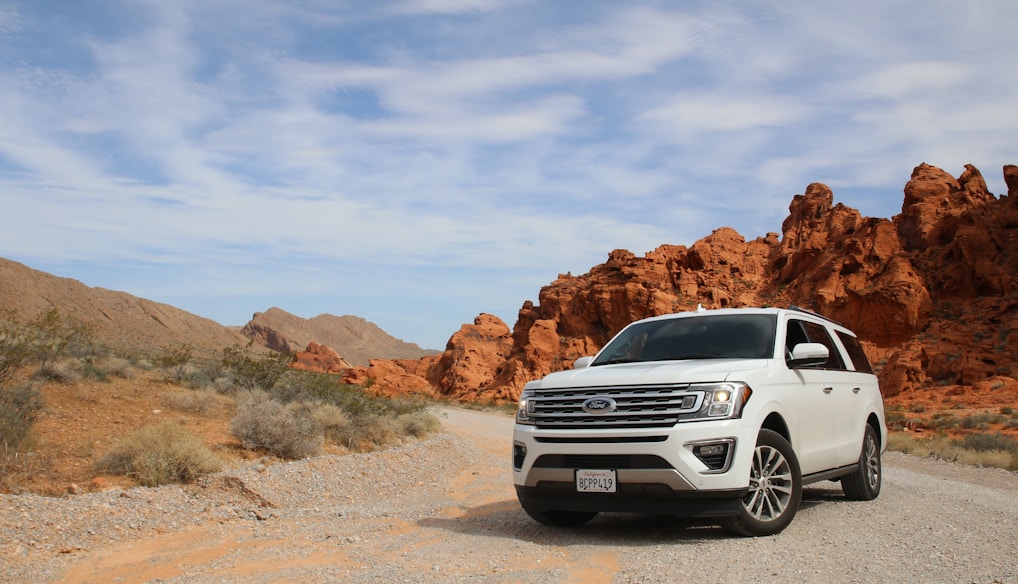 parked white Ford Explorer SUV