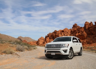 parked white Ford Explorer SUV