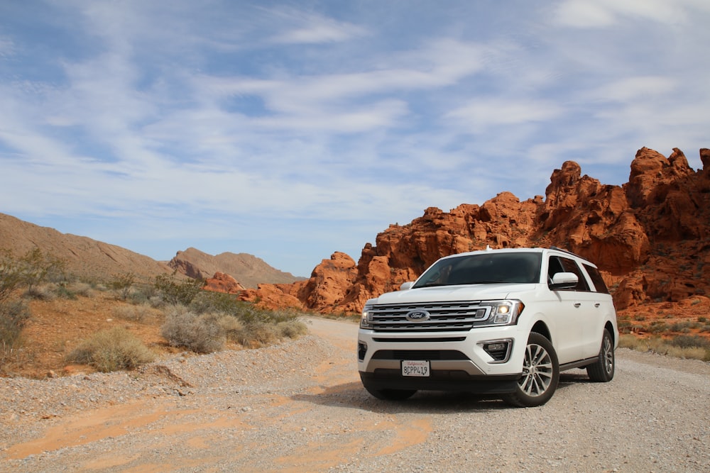 parked white Ford Explorer SUV