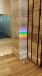 Close-up of a polished marble floor reflecting soft natural light in an elegant living room