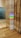 A polished marble wall and floor create a sleek and modern interior scene. A vibrant rainbow reflection appears on the marble surface, originating from an unseen light source. The colors of the rainbow stand out against the neutral tones of the marble.
