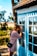 woman peeking on glass door