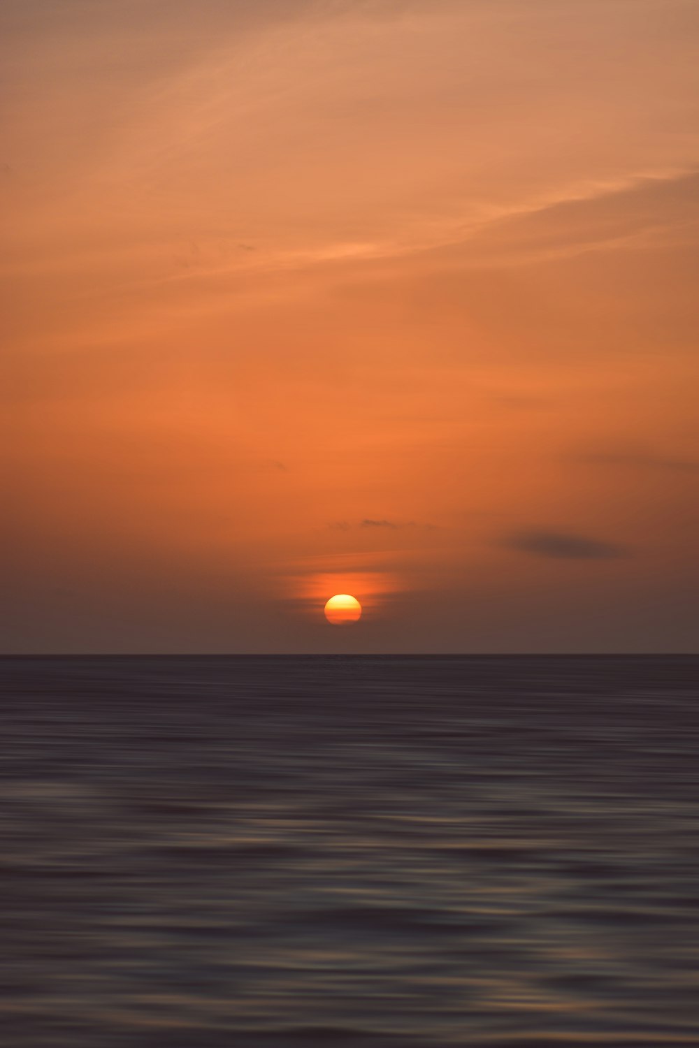 sunset in front of body of water