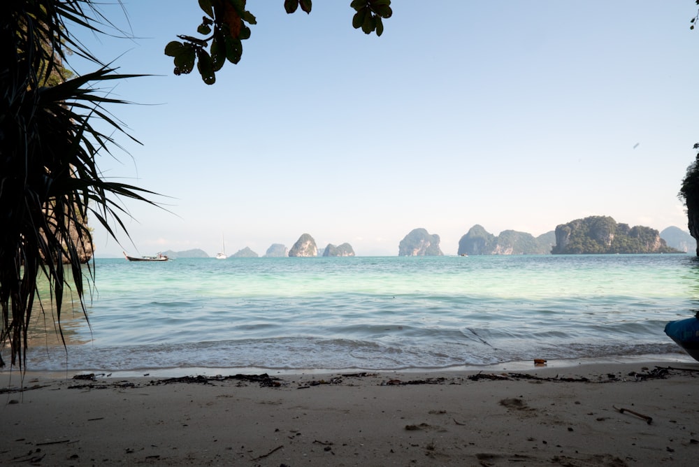 view of islands from white sand beach