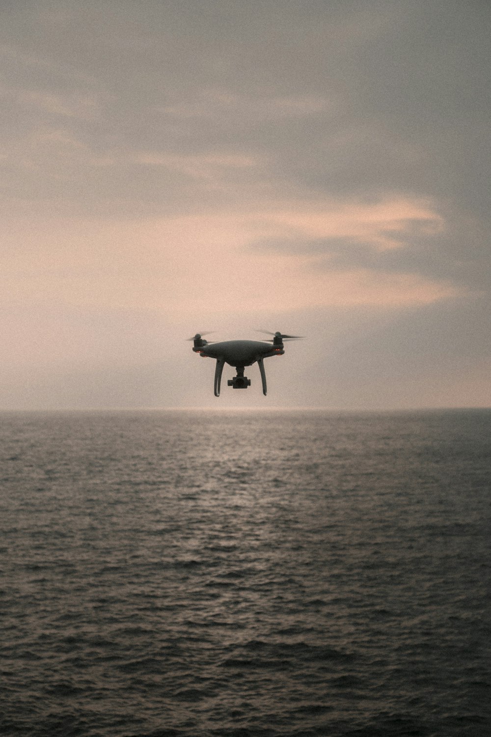 drone over ocean during daytime