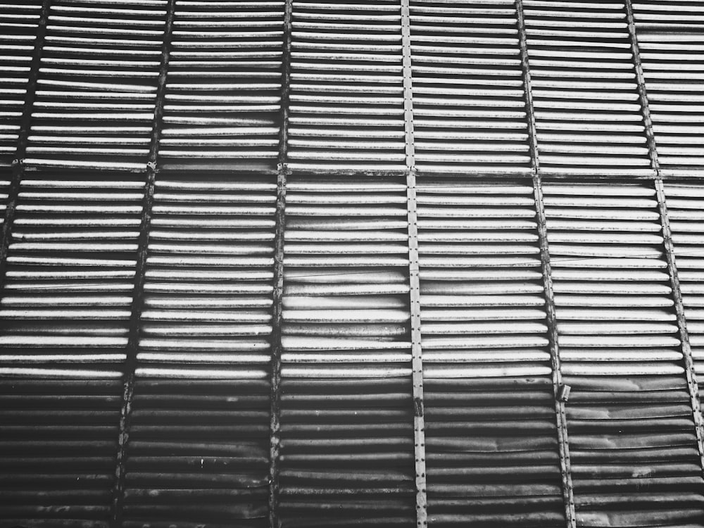a black and white photo of a metal grate