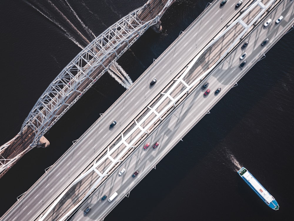 bird's-eye view of cars on gray bridge