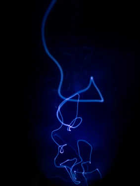 A glowing neon-blue abstract AI network weaving through a sleek dark futuristic cityscape background.