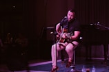 A musician performing live acoustic music in the lounge.