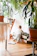 A cozy, sunlit corner with children's books and a small plant, reflecting a nurturing learning space.