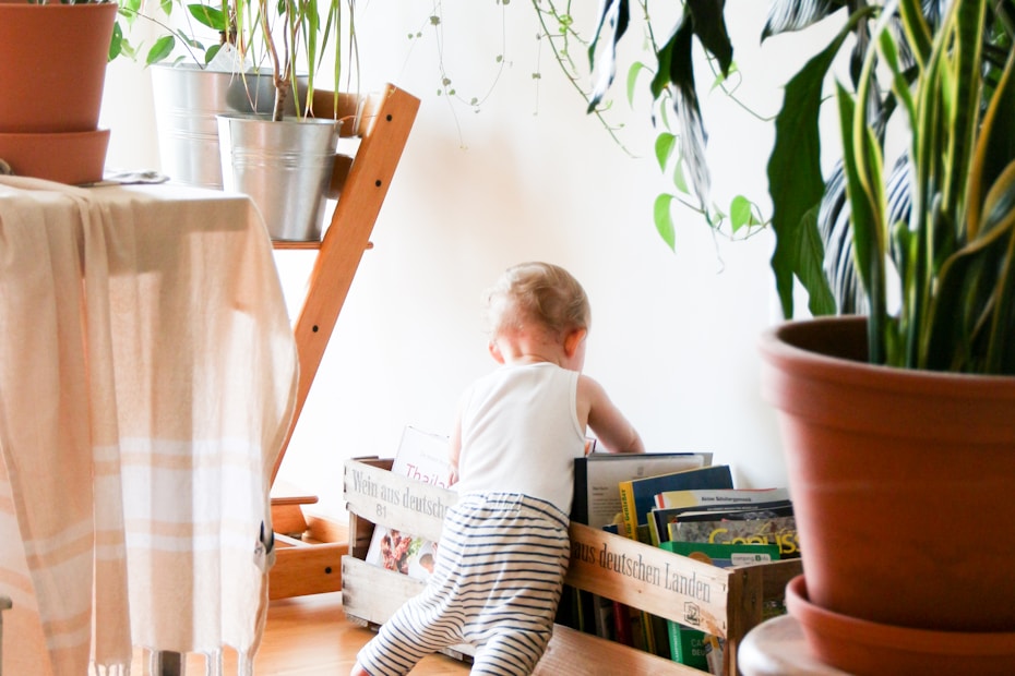 toddler wearing white tank top near white wall (safety tips)