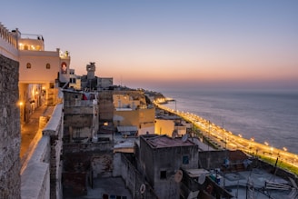 concrete buildings near shore