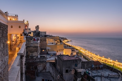 concrete buildings near shore