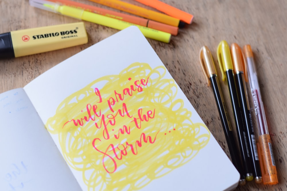 yellow Stabilo Boss highlighter beside sketch book