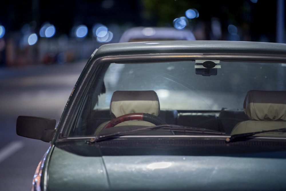 selective focus photograph of blue vehicle