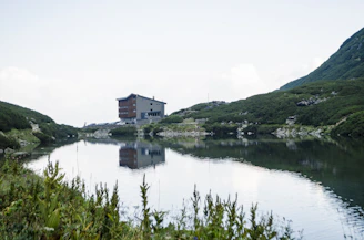 A serene landscape showcasing a modern building integrated into nature.
